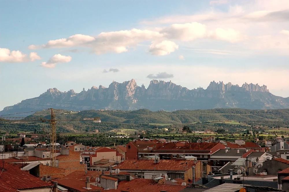The distinctive mountain peaks of Montserrat above the Catalan countryside