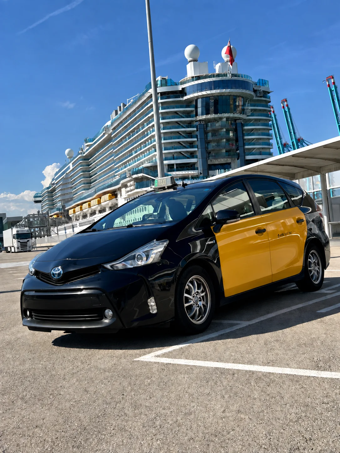 Front view of our Toyota Prius+ taxi at Barcelona cruise port